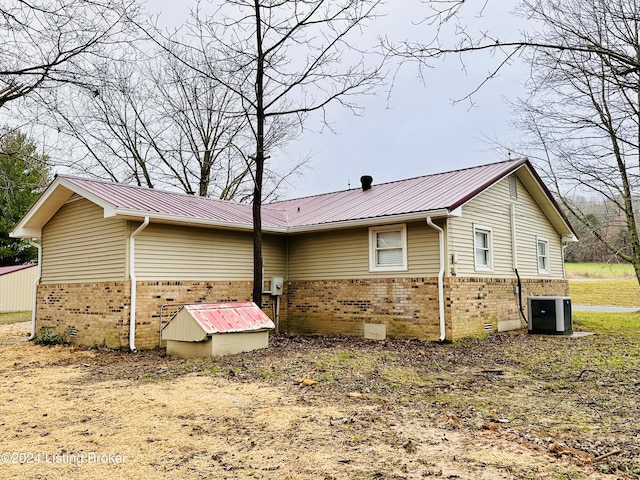 view of home's exterior featuring central AC unit