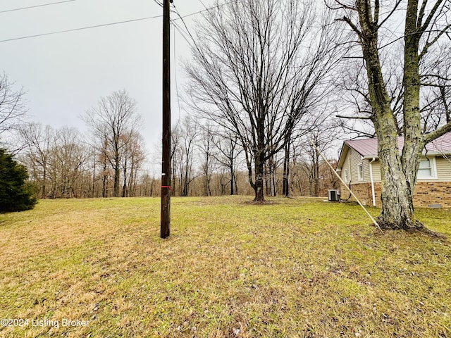 view of yard featuring central AC unit