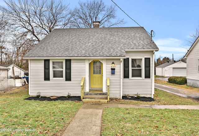 bungalow-style house with a front yard