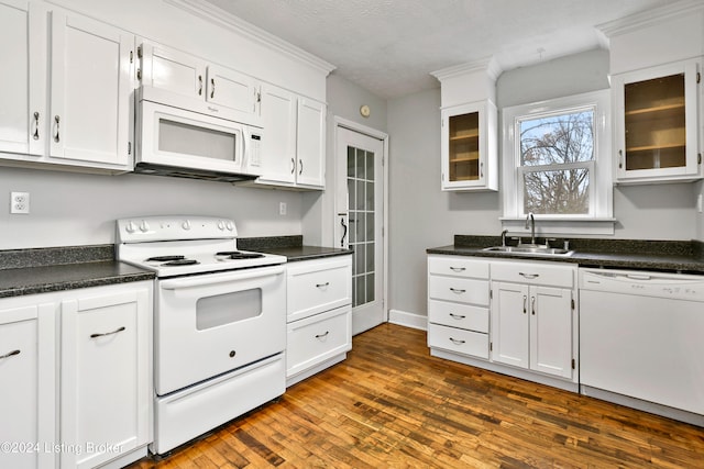 kitchen featuring sink, white cabinets, dark hardwood / wood-style floors, and white appliances