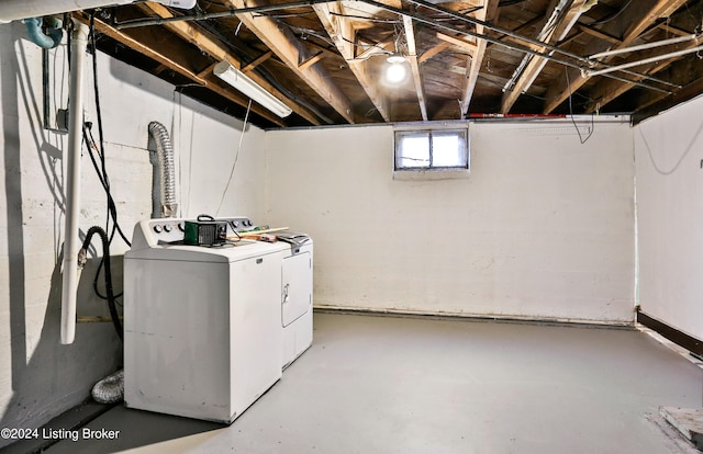 washroom featuring washer and clothes dryer