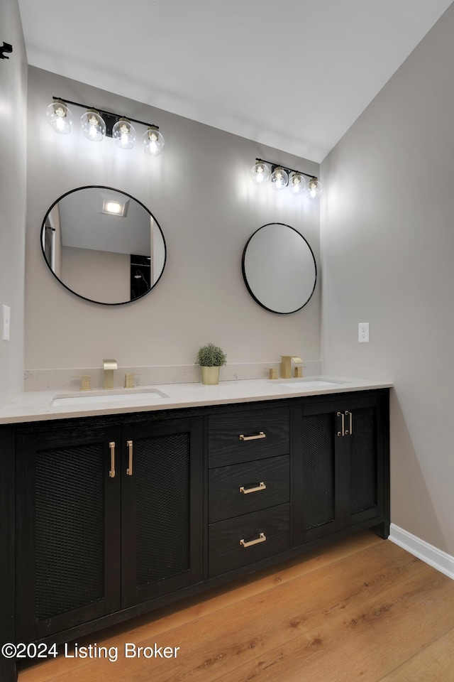 bathroom featuring vanity and hardwood / wood-style floors