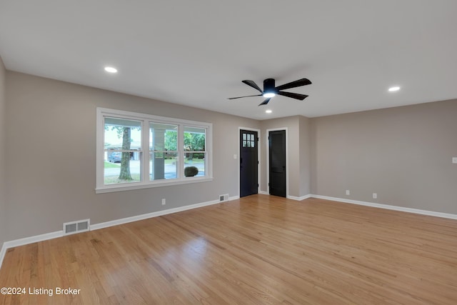 spare room with ceiling fan and light hardwood / wood-style flooring