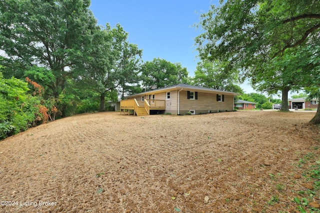 exterior space featuring a wooden deck