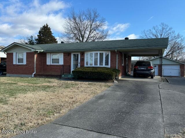 ranch-style home with a front yard and a carport