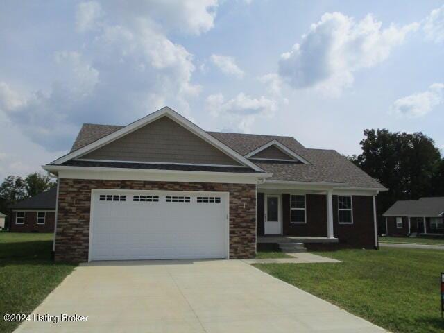 view of front facade featuring a garage and a front lawn