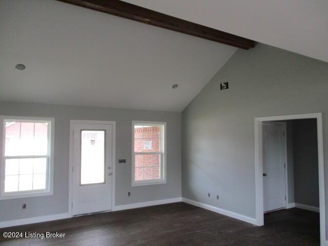 entryway featuring beam ceiling, dark hardwood / wood-style floors, and high vaulted ceiling