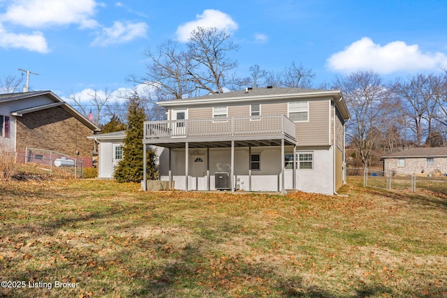 back of house featuring a deck, cooling unit, a yard, and fence