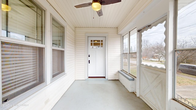 sunroom with ceiling fan and plenty of natural light