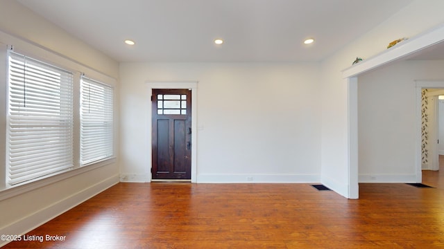 entryway with dark wood-type flooring