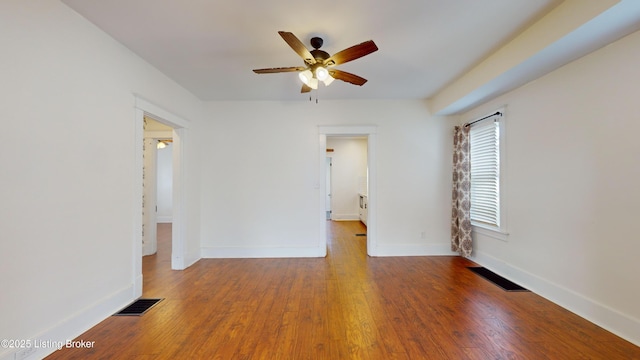 spare room with ceiling fan and hardwood / wood-style floors