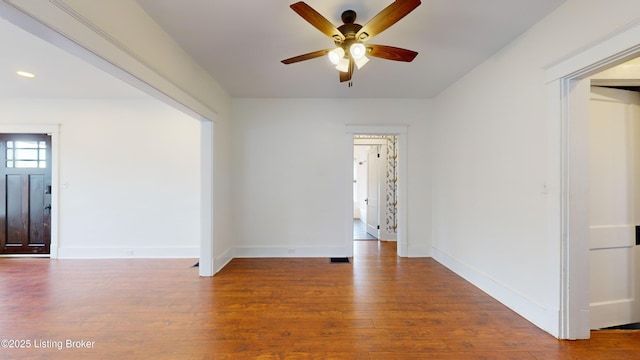 unfurnished room featuring hardwood / wood-style flooring and ceiling fan