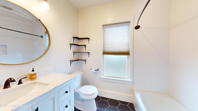 full bathroom featuring washtub / shower combination, tile patterned floors, vanity, and toilet