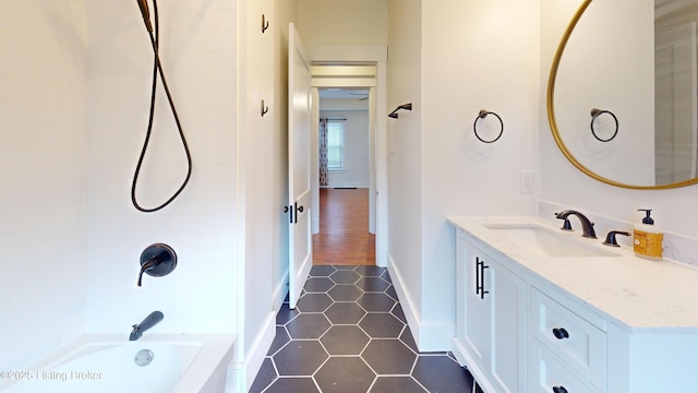 bathroom featuring tile patterned floors, shower / washtub combination, and vanity