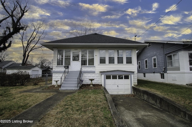 view of front of home with a yard