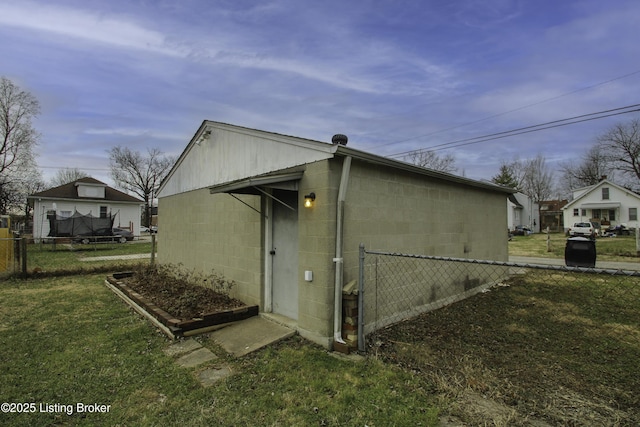 view of home's exterior with a yard