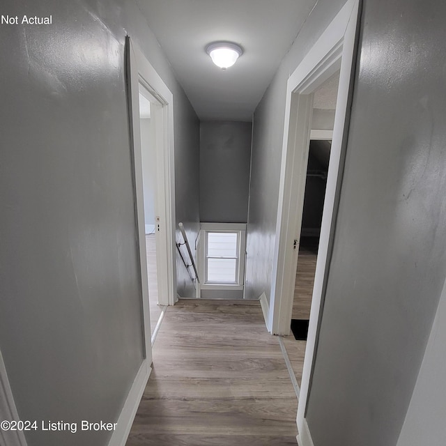 corridor featuring light hardwood / wood-style floors