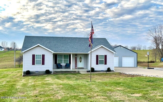 ranch-style home featuring covered porch and a front yard