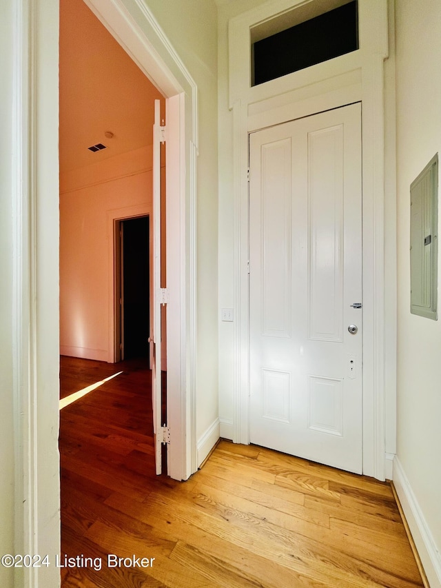 interior space with hardwood / wood-style flooring and electric panel