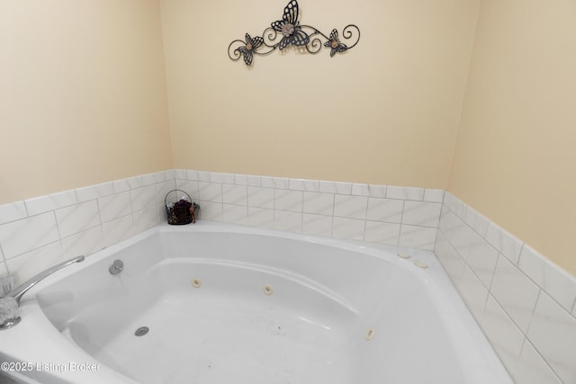 bathroom with tiled bath