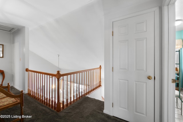 corridor featuring carpet floors and lofted ceiling