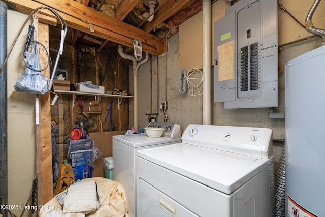 laundry area with gas water heater, washing machine and dryer, and electric panel