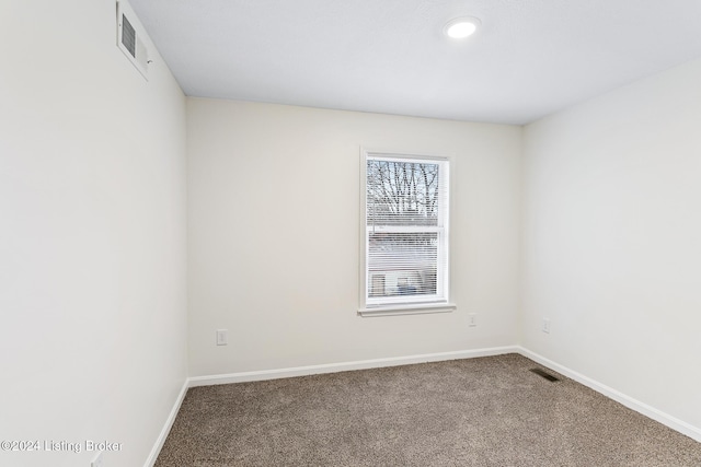 empty room featuring carpet floors