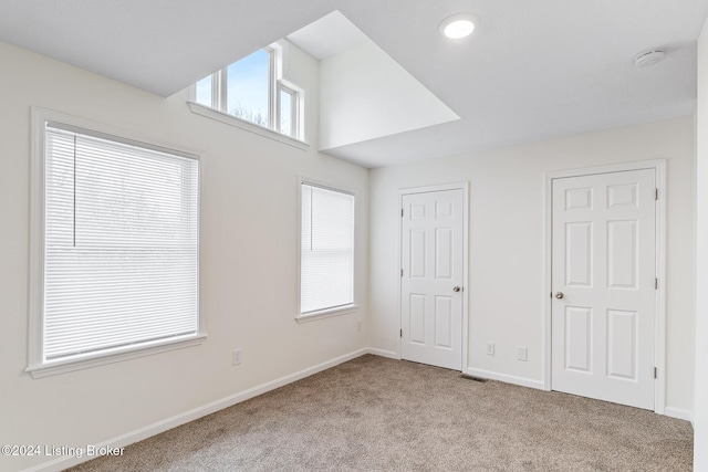 unfurnished bedroom with light carpet