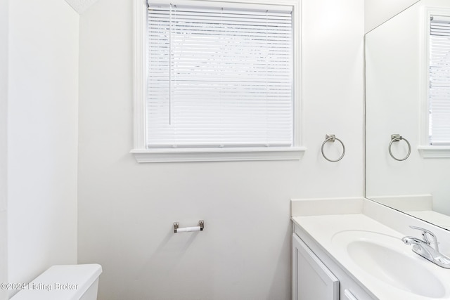 bathroom with vanity and toilet