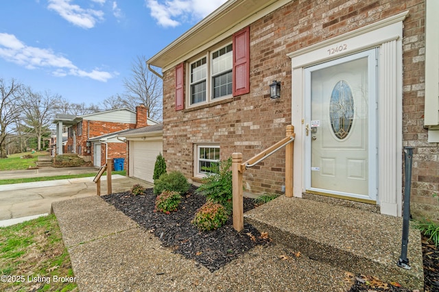 view of exterior entry featuring a garage