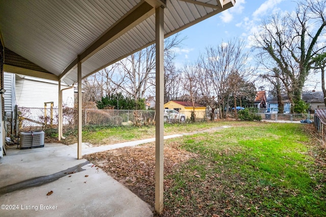 view of yard with cooling unit and a patio area