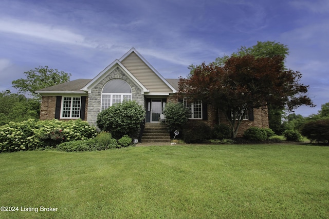 view of front of home with a front lawn