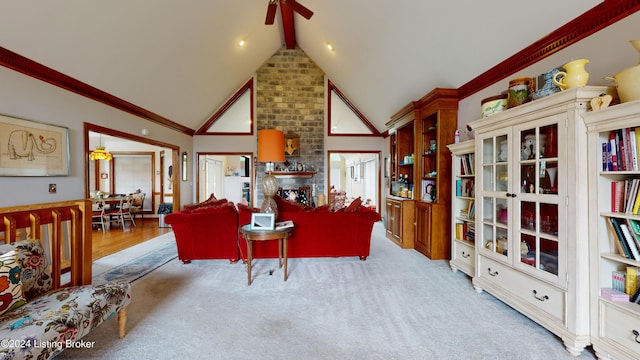 carpeted living room featuring ceiling fan and lofted ceiling with beams