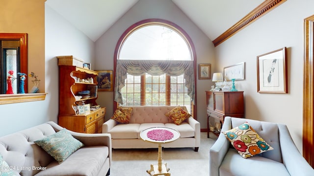 sitting room with light carpet and lofted ceiling