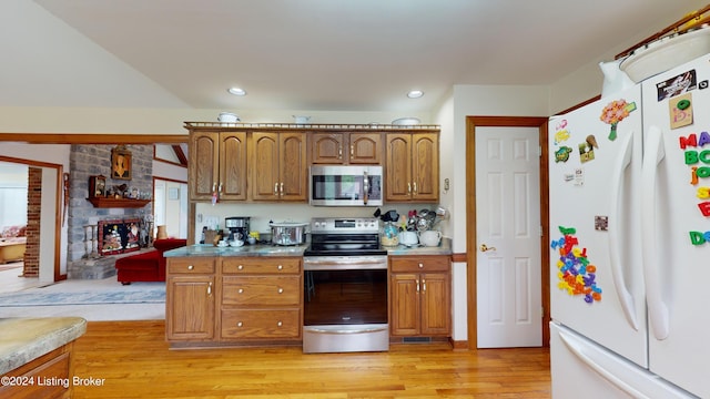 kitchen featuring light hardwood / wood-style floors, stainless steel appliances, and pool table