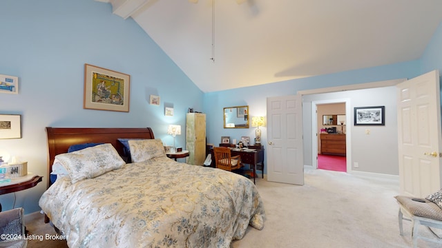 carpeted bedroom with beamed ceiling and high vaulted ceiling