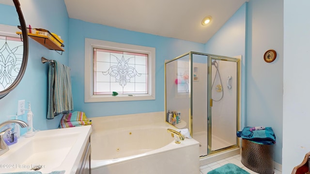 bathroom with plus walk in shower, tile patterned floors, and sink