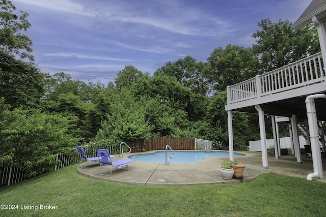 view of swimming pool with a lawn and a patio area