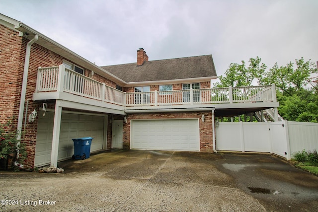 back of property with a garage