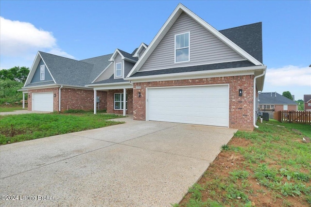 view of front of house featuring a front lawn and a garage