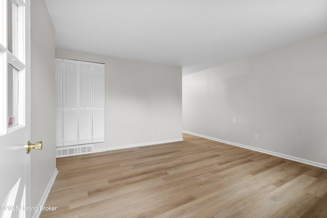 unfurnished room featuring light wood-type flooring