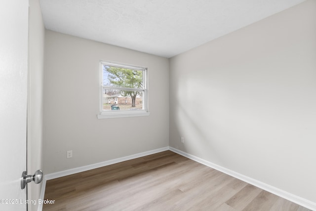 spare room with light wood-type flooring