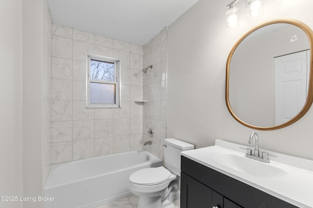 full bathroom featuring toilet, vanity, and tiled shower / bath combo