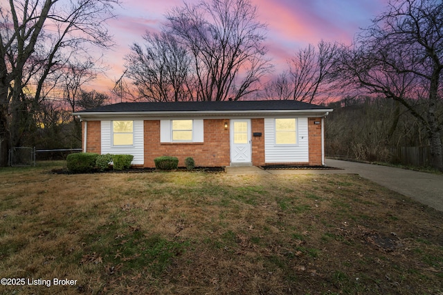 ranch-style house featuring a yard