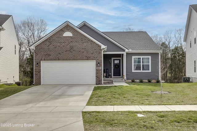 view of front of home featuring cooling unit, a garage, and a front lawn