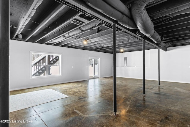 basement featuring plenty of natural light and electric panel