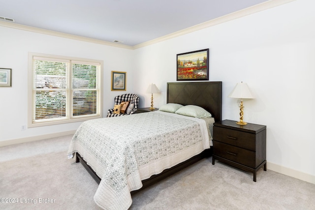 carpeted bedroom featuring crown molding