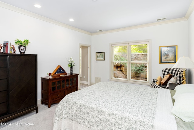 bedroom with light carpet and crown molding