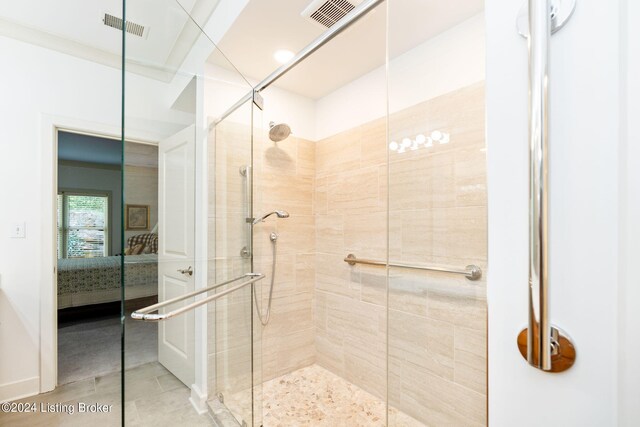 bathroom featuring a shower with shower door