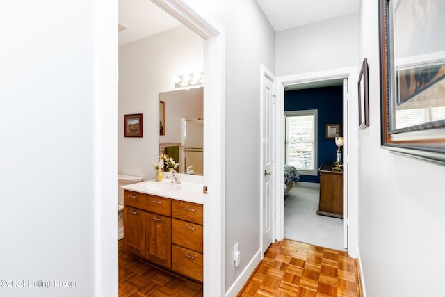 hall with light parquet flooring and sink